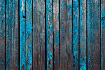 old battered peeling boards painted blue