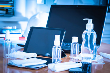 Naklejka premium Treatment of equipment with disinfectants. Elimination of microbes in the workplace and equipment. Use of sanitizers. Antiseptics.