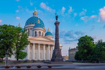Fototapeta na wymiar Saint Petersburg. Russia. Trinity-Izmailovsky Cathedral in St. Petersburg. Column of Glory in front of the Trinity Cathedral of St. Petersburg. Monuments Of Russia. Summer trip to Russia.