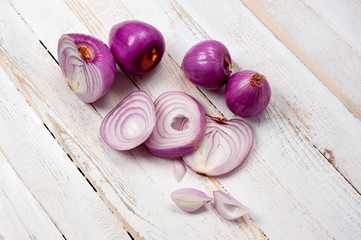 Red onion, lettuce. Health benefits, very rich in vitamins. Background for vegetables and garden plants and cooking.