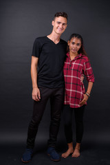 Portrait of happy young multi ethnic couple together