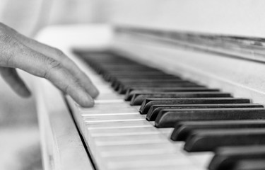 Close up white piano keyboard. Music instrument. Black and white key. Play sound, chord, melody. Classical, musical art. Jazz performance, entertainment. Musician background. Classic note harmony.