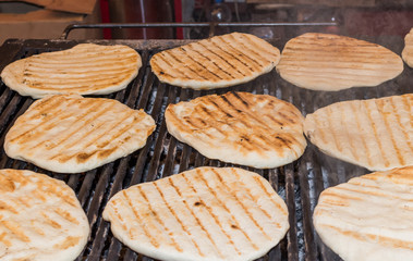 Pita bread on the grill during fast food festival, street food