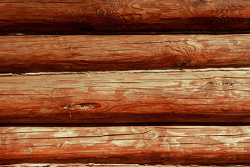 Brown, painted, wooden wall of beams. Background. Texture.