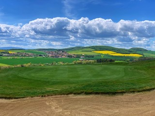 Golf course between the fields in rural Czech Republic