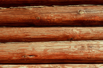 Brown, painted, wooden wall of beams. Background. Texture.