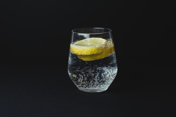 Gin tonic isolated on black background