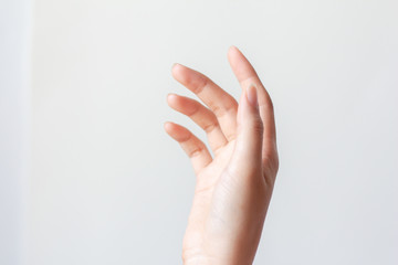 Hand of woman on white background.