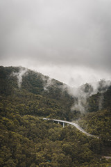 fog in the mountains after rain and flyover road