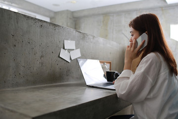 multitasking woman is in home office