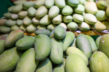 Mango on the counter in the market .