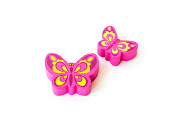 Wooden figure for children to play with. The butterfly shape. Butterfly made of pink wood