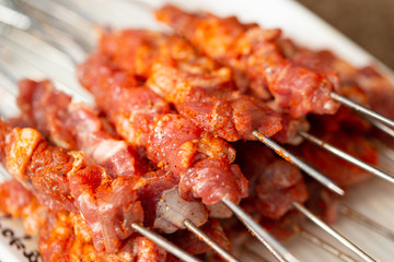 Spicy raw chicken BBQ skewers 