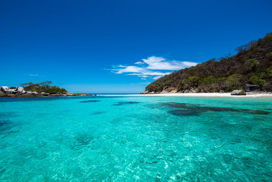 Racha Noi Island on a clear day with clear sea water during the high summer season,Phuket,Thailand.