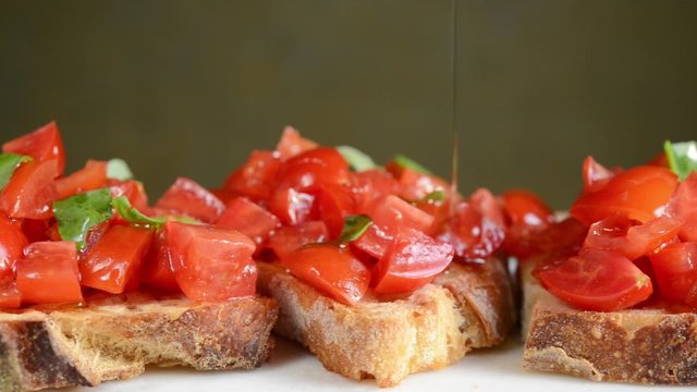 Tomato bruschetta and extra virgin olive oil. Copy space.