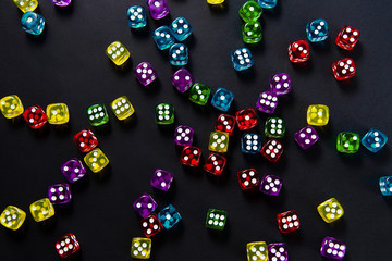 Bright and colorful dice set on black background
