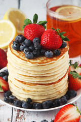A stack if home-made pancakes with berry