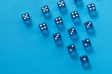 Rows of dice on blue background, triangle