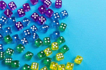 Bright and colorful dice set on blue background