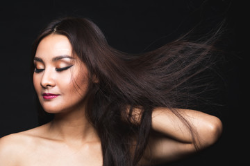 Fototapeta premium Portrait of young asian woman with makeup long hair.