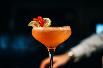 Cocktail's decoration with fruit like a flower.