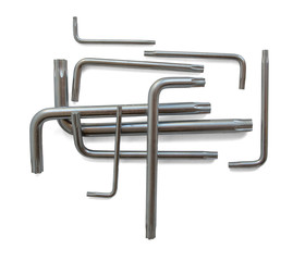 A set consisting of a group of nine metal wrenches with a star tip in different sizes from small to large, stacked on top of each other in a composition. Isolated on a white background.