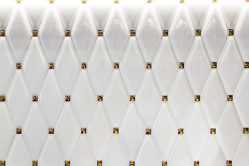 Decorative background with white tiles on the wall.
