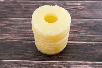 Yellow juicy pineapple rings.  top view close up. Chopped caramelized canned pineapple. Raw food diet.