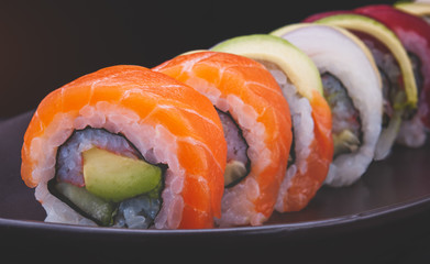 Mix sushi roll salmon and other fishes.