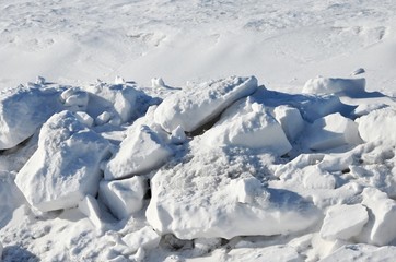 Fototapeta na wymiar Chunks of Snow by the Road