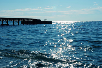 blue sea sparkles in the sun