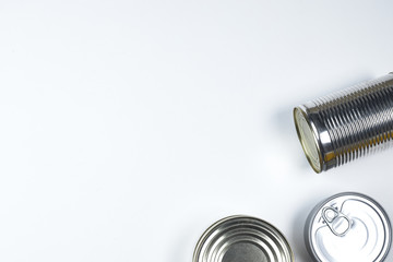 tin cans of different sizes on a white background. copyspace