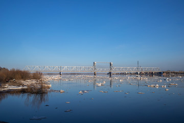 Spring evening in Arkhangelsk. Ice drift on the Severnaya Dvina river. The world's northernmost drawbridge.