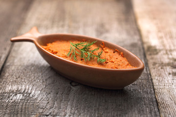 Fish paste with tomatoes. Sandwich paste.
Appetizing dish on a wooden background.