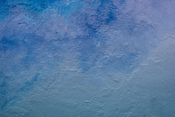 Abstract blue color tone painted wall texture background outdoors