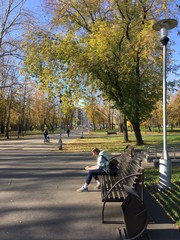 Beautiful autumn day. People walk in the park.