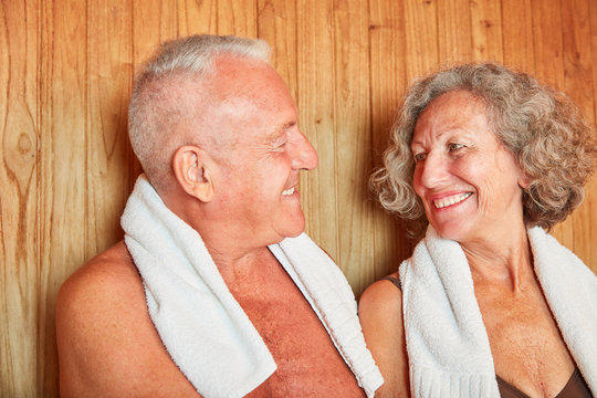 Happy seniors couple in the sauna