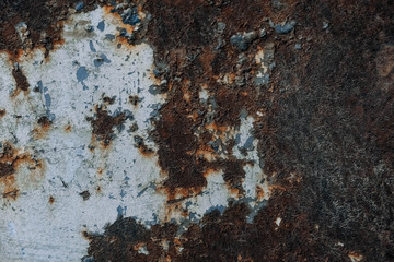 Rusty metal surface with blue paint residue as background image. Place for text or advertising