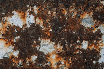 Rusty metal surface with blue paint residue as background image. Place for text or advertising