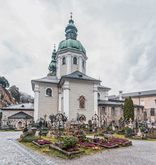 Fototapeta premium St Mary's Chapel with onion dome and cemetery ground in front inside St Peter Abbey in Salzburg
