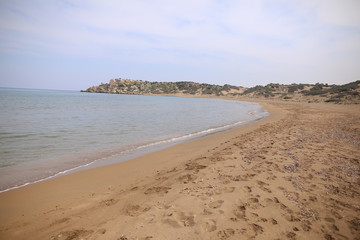 Fototapeta na wymiar Desert landscape of Northern Cyprus Kyrenia coastline with stones and sand Alagadi turtle beach.