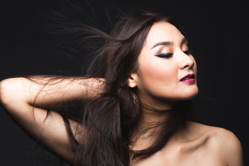 Fototapeta premium Portrait of young asian woman with makeup long hair.