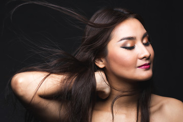 Portrait of young asian woman with makeup long hair.