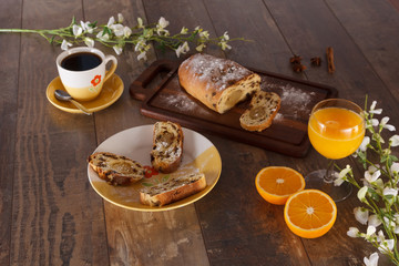 Fototapeta na wymiar Easter breakfast with raisin bread, orange juice and coffee