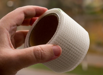 Sticky yellow mesh tape.