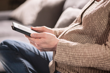 Fototapeta premium Maternity and Leisure - Pregnant Woman Reading an E-Book