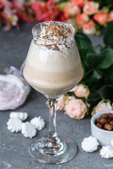 cold fresh ice coffee with chocolate, garnished with biscuit and sweets