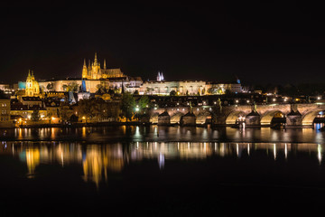 Fototapeta na wymiar Czech Republic. Cityscape of Prague at night with view of Charles Bridge and Prague Castle.