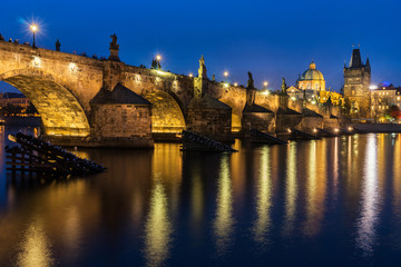 Fototapeta na wymiar View of Charles Bridge in Prague, Czech Republic at sunset (blue hour). Charles Bridge is one of the most visited places in Prague. 