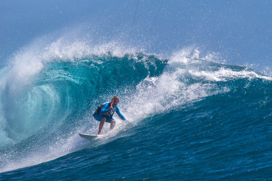 Kite surfer rides among the huge tubes and waves of the Indian Ocean on the island of Mauritius